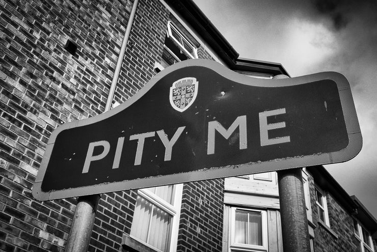 Welcome Sign to Pity Me